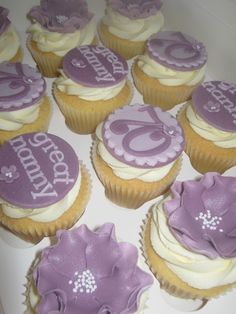 cupcakes with purple frosting are arranged in a circle