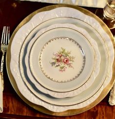 a table set with plates and silverware on it