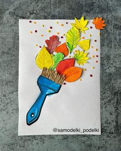 a card with leaves and a blue blow dryer