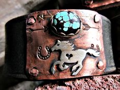 Running free cuff bracelet by Weathered Soul, horse lover, equestrian, cowgirl, rustic cuff, artisan cuff, horse cuff, turquoise cuff, USA. Bronze snap set at approx. 7 and 8 inches. Copper hammered and riveted to recycled leather distressed black belt with sterling horse and sterling bezel set turquoise matrix stone. Artisan made in the USA. Please feel free to convo me with any questions. Note* Listing is just for the horse cuff. Other cuffs sold separately. Western Patina Cuff Bracelet Gift, Handmade Western Style Cuff Bracelet, Handmade Western Cuff Bracelet As Gift, Copper Jewelry Diy, Silversmith Jewellery, Striped Earrings, Rustic Cuff, Leather Ring, Rustic Jewelry