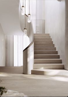 a spiral staircase in an empty room with white walls