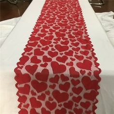 a long table with red and white hearts on it