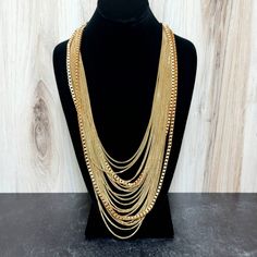 "Glamorous multiple strand mixed chain necklace. More than a dozen chains of two different sizes drape around your neck with stunning results! The perfect vintage accessory for holiday parties. Approx 30\" with an adjustable length. c1990 To see our sale jewelry follow the link below and choose the section titled Jewelry. www.tinglazesandglass.etsy.com Follow us on Facebook and Instagram @tinglazesandglass Visit both our Etsy shops: www.tinglazesandglass.etsy.com \"estate sale majolica, faience, Multi-strand Figaro Chain Necklace, Gold Multi-strand Figaro Chain Necklace, Gold Multi-strand Layered Necklace With Figaro Chain, Gold Multi-strand Necklace With Figaro Chain, Gold Double Chain Necklace For Party, Long Double Chain Necklace For Parties, Party Necklace With Double Snake Chain, Party Double Snake Chain Necklace, Party Double Chain Long Necklace