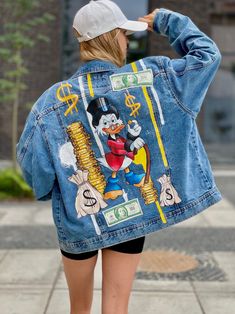 Hand-painted jean jackets: The perfect way to add a personal touch to your wardrobe and stand out from the crowd. Fabric paints, which I use to create a picture on denim jackets, meet the highest quality standards. They provide brightness and color stability that will not fade even after many washes. Usually people wear painted jackets for 5+ years and they still look good. Care instructions included in every order. IMPORTANT  The jacket you see in the photo has already been bought and lives with its owner. This is an example of the work I can do for you. You can order the same one, or one with your own idea. Available sizes: From S to XXL Available colour: Black, blue, light blue, grey HOW TO MAKE ORDER Step1: Feel free to write me message and describe your wishes about painting. Step 2: Disney Jean Jacket, Hand Painted Jean Jacket, Painted Jean Jacket, Disney Fits, Outfit Disney, Custom Denim Jacket, Jean Jacket For Girls, Painted Jacket, Custom Denim