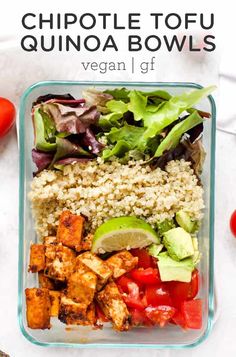 a glass container filled with vegetables and tofu quinoa bowls on top of a white table