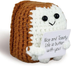 a stuffed animal holding a sign that says wee and tasty life is butter with you