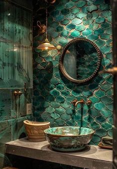 a bathroom that has a sink and mirror on the wall in front of green tiles