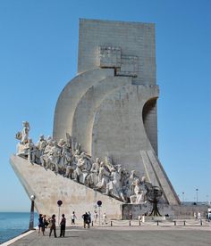 people are standing in front of the monument