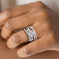 Designed to evoke your innate elegance and charm, this beautiful set showcases a sparkling round cut center stone wrapped in a halo frame, while additional shimmering stones adorn the chevron shank. The inner band is brightened by a half-circle of round stones, completing the fabulous triple split shank design. This interchangeable style bridal set would skip a beat for many and will bedazzle your ensemble. Features Moissanite was originally found in meteorites(Chemical name: Silicon Carbide). I Marriage Gifts, Bridal Engagement Rings, Stone Wrapping, Pretty Box, Moissanite Jewelry, Stone Setting, Engagement Ring Set, Split Shank, Timeless Jewelry