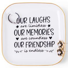 a white and gold tray with a quote on it that says our laughs are limities, our memories are countless our friendship is endless