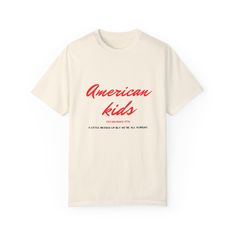 t-shirt, graphic tee, beach, sun, sand, Kenny Chesney, concerts, summer, relaxed fit, good vibes Enhance your wardrobe with this Kenny Chesney inspired "American Kids" t-shirt. Whether it's a day in the sun, or a day in the sand with a drink in hand. Made from premium, quality fabric it ensures comfort and durability. For everyday wear or special occasions. Wear it yourself or gift it to someone you know would love it in your life! * Shipping and Production Time* Production is 2-4 business days. Trendy Summer T-shirt For Music Festival, Retro Summer T-shirt With Slogan, Relaxed Fit Short Sleeve T-shirt For Music Festival, Summer Band Merch Red Tops, Red Band Merch Tops For Summer, Short Sleeve Slogan T-shirt For Summer, Summer Music Festival Short Sleeve T-shirt, Retro Text Print T-shirt For Beach, Short Sleeve T-shirt For Summer Music Festival