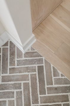 an image of a bathroom floor that looks like it is made out of wood planks