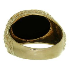 For Sale on 1stDibs - This classic estate men's ring features a large oval black onyx stone set in nugget-textured 14k yellow gold. Made in United States circa 1970s. Measurements: Gold Onyx Signet Ring For Anniversary, Formal Nugget Shaped Signet Ring With Polished Finish, Gold Oval Onyx Rings, Gold And Onyx Ring Men, Mens Gold Onyx Ring, Elegant Yellow Gold Onyx Signet Ring, Luxury Vintage Onyx Jewelry, Luxury Men's Yellow Gold Onyx Ring, Black Onyx Stone