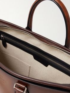 Berluti's skill in crafting leather has attracted clients from The Duke of Windsor to Andy Warhol. Made in Italy, this classic briefcase has two slip pockets, along with a two-way zip fastening and the house's logo embossed on the front. The adjustable shoulder strap can be detached, so you can carry the it by hand. Duke Of Windsor, Leather Briefcase Men, Briefcase For Men, Leather Briefcase, Home Logo, Andy Warhol, Leather Craft, Windsor, Shoulder Strap