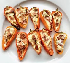 several pieces of stuffed bell peppers on a white plate