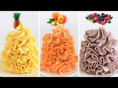 three different types of cake with fruit on top and one in the shape of a pineapple