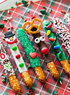 christmas cookies and pretzels are arranged on a table