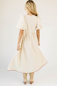 from family pictures to fall date nights, this lace up puff sleeve dress does it all, (+ then some). with its vintage-inspired shape + faux leather seam details, it pairs perfectly with boots, heels, or flats. two tone linen // midi length, scoop neckline, front tie closures, back zipper closure, elastic cuffs, faux leather seam + tie detailing model is 5'8" + wearing a small measurements are approximate + taken while laying flat xsmall : bust 33" length 49" small : bust 35” length 49” medium : Fall Dates, Pu Fabric, Puff Sleeve Dress, Boots Heels, Puffed Sleeves Dress, Family Pictures, Small Bust, Scoop Neckline, Midi Length