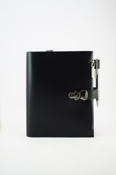 a black binder with two rings on it