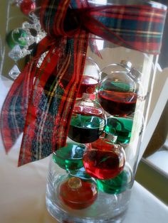 a glass vase filled with red and green liquid