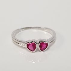 "Thanks for shopping our vintage estate store. We tend to sell well below wholesale and truly hope you enjoy all of our items. Many of the items are one of a kind, so please enjoy scrolling through the pictures and hopefully something will catch your eye. Brown spots are from the camera. Estate nice sterling silver 925 red .25ct ruby heart ring. This is a custom made ring for our shop. Ring size: please select a size Setting: 4mm 1/4\" Band width: 1.5mm Weight: 1.15 grams There are no scratches Adjustable Silver Birthstone Ring For Valentine's Day, Classic Silver Ruby Ring For Valentine's Day, Valentine's Day Classic Anniversary Birthstone Ring, Silver Rings With Hallmarks For Valentine's Day, Silver Heart Ring With Birthstone For Formal Occasions, Formal Silver Heart Ring With Birthstone, Nickel-free Pink Rings For Anniversary, Ruby Heart Ring, Beach Rings