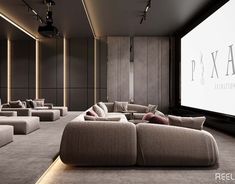 a large room with couches and a projector screen