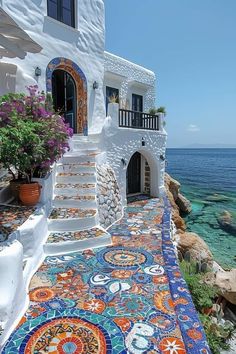 an outdoor area with colorful tiles on the ground