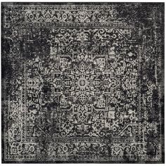 black and white rug with an intricate design