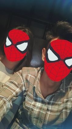 two boys with their faces painted to look like spider - man