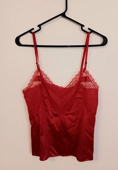 size: 34"  length from armpit: 13 1/2"  This Camisole is from the late 1970s - early 1980s.  A vibrant cherry red color! It has adjustable straps, a v-neckline and gorgeous lace detailing all along the top.  It's in great condition. Red Camisole With Adjustable Straps, Red Cami Tank Top With Adjustable Straps, Red Tank Top With Straps For Party, Red Fitted Tank Top With Adjustable Straps, Red Camisole Tank Top With Straps, Red Tank Top With Spaghetti Straps And Built-in Bra, Red Sleeveless Camisole With Adjustable Straps, Red Spaghetti Strap Camisole With Adjustable Straps, Fitted Red Camisole With Built-in Bra