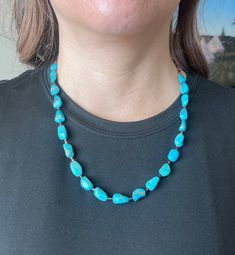 Vibrant, Southwestern, and versatile beaded American Turquoise & Brown Shell necklace that is handcrafted by me! This necklace is lightweight and comfortable, making it ideal for everyday wear. It adds a pop of color and a Southwestern vibe to your outfit. You can pair this simple Turquoise necklace with anything. It would be a beautiful addition to your outfit! The stones are genuine American Turquoise and Brown Shell. All findings are 925 sterling silver. Measurements: 22" long with 10mm genui Southwestern Turquoise Gemstone Beads Necklace, Southwestern Turquoise Necklace With Large Beads, Adjustable Southwestern Turquoise Necklace Hand-strung, Southwestern Adjustable Turquoise Necklace Hand-strung, Adjustable Southwestern Hand-strung Turquoise Necklace, Southwestern Adjustable Hand-strung Turquoise Necklace, Southwestern Style Adjustable Hand-strung Turquoise Necklace, Bohemian Turquoise Healing Necklace Single Strand, Southwestern Single Strand Turquoise Necklace