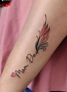 a woman with a tattoo on her arm that says,'mera dad '