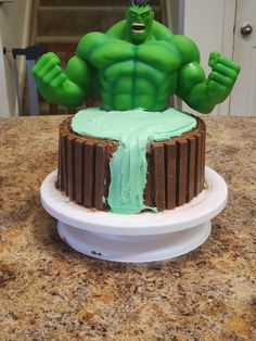 there is a cake that looks like the incredible hulk from avengers on top of it