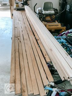 a pile of wooden planks in a garage