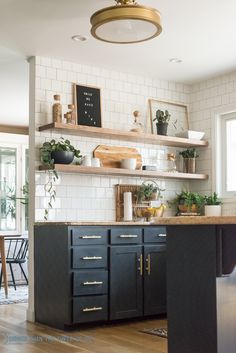 the kitchen is clean and ready to be used as a place for potted plants