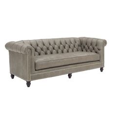 an image of a couch that is in the style of a tufted chesterfield sofa