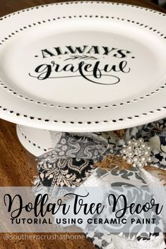 two white plates sitting on top of each other with the words always grateful painted on them