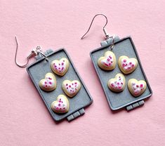 These charming Heart Cookie Earrings are the perfect personalized gift for bakers! Handmade Jewelry from polymer clay, each cookie pan earring features adorable heart-shaped cookies on a cookie pan. The cookies are adorned with festive white frosting and red and pink sprinkles, sure to bring a smile to any face! These novelty earrings make a special birthday gift for her or as teacher earrings. These dessert earrings would also make the best gift for Mom or Grandma gifts. Lightweight and comfort Sweet White Heart Earrings For Valentine's Day, Polymer Clay Heart Earrings For Valentine's Day Gift, Polymer Clay Heart Earrings As Valentine's Day Gift, Valentine's Day Gift Polymer Clay Heart Earrings, Heart Sugar Cookie, Heart Shaped Cookies, Valentines Earrings, Best Gifts For Mom, Special Birthday Gifts