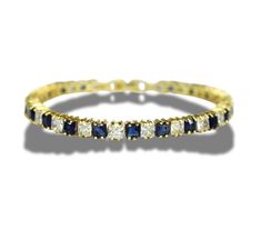 Elevate your jewellery collection with this stunning yellow gold tennis bracelet, featuring a dazzling arrangement of princess-cut-created diamonds and vibrant blue sapphires. The combination of these exquisite stones creates a striking contrast, perfect for adding a touch of elegance to any outfit, whether for a special occasion or everyday wear. This bracelet is not only a beautiful accessory but also a meaningful gift, ideal for birthdays, anniversaries, or just to show someone you care. It c Luxury Blue Tennis Bracelet For Anniversary, Luxury Elegant Sapphire Tennis Bracelet, Luxury Blue Tennis Bracelet For Wedding, Gold Tennis Bracelet, Bracelet Tennis, Timeless Luxury, Wedding Jewelry Bracelets, Vibrant Blue, Wedding Bracelet