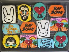 some decorated cookies are sitting on a cooling rack with the words bap bunny written in it