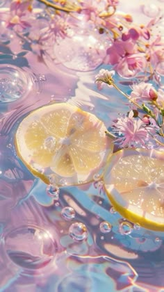 some lemons and flowers floating in water