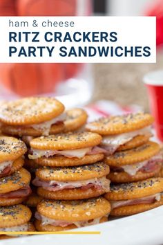 ham and cheese ritz crackers party sandwiches on a white plate with red cups in the background