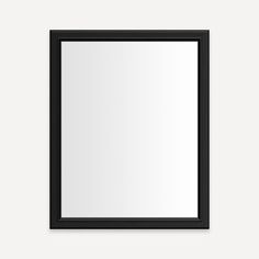 an empty black frame hanging on the wall