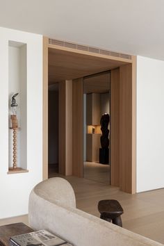 a living room filled with furniture and white walls