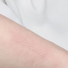 a person with a tattoo on their arm