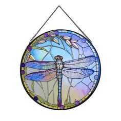 a stained glass window with a dragonfly on it's side hanging from a chain