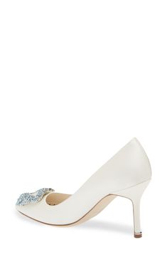 Say 'I do' to the timeless beauty of this satin pump featuring the Hangisi's signature crystal brooch at the almond toe updated in a something-blue hue. 3 1/4" (83mm) heel Textile upper/leather lining and sole Made in Italy Designer Shoes Elegant Crystal Embellished Heels For Gala, Elegant Embellished Wedding Shoes With Almond Toe, Elegant Embellished Almond Toe Wedding Shoes, White Elegant Shoe Clips For Formal Occasions, Elegant Rhinestone Wedding Shoes For Formal Occasions, Elegant White Shoe Clips For Formal Occasions, Elegant White Formal Shoe Clips, Elegant High Heel Wedding Shoes For Reception, Elegant Closed Toe Heels For Reception