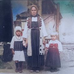 an old black and white photo of three children