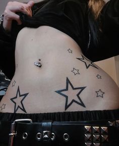 a woman with stars on her stomach