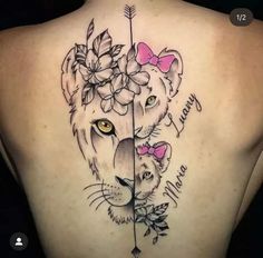 a woman's back with a lion and flowers on it